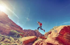 Man jumping through desert