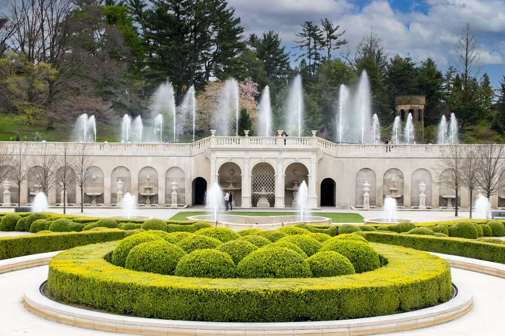 Longwood Gardens fountains with trimmed hedges and sprays of water on a sunny day in Chester County, a highlight of a Mid-Atlantic fall road trip.