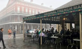 A jazz band plays in front of Cafe du Monde on a foggy morning in New Orleans.