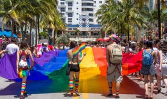 A vibrant procession fills Miami Beach streets with rainbow flags and cheering crowds during the annual Gay Pride Parade, celebrating love and equality.