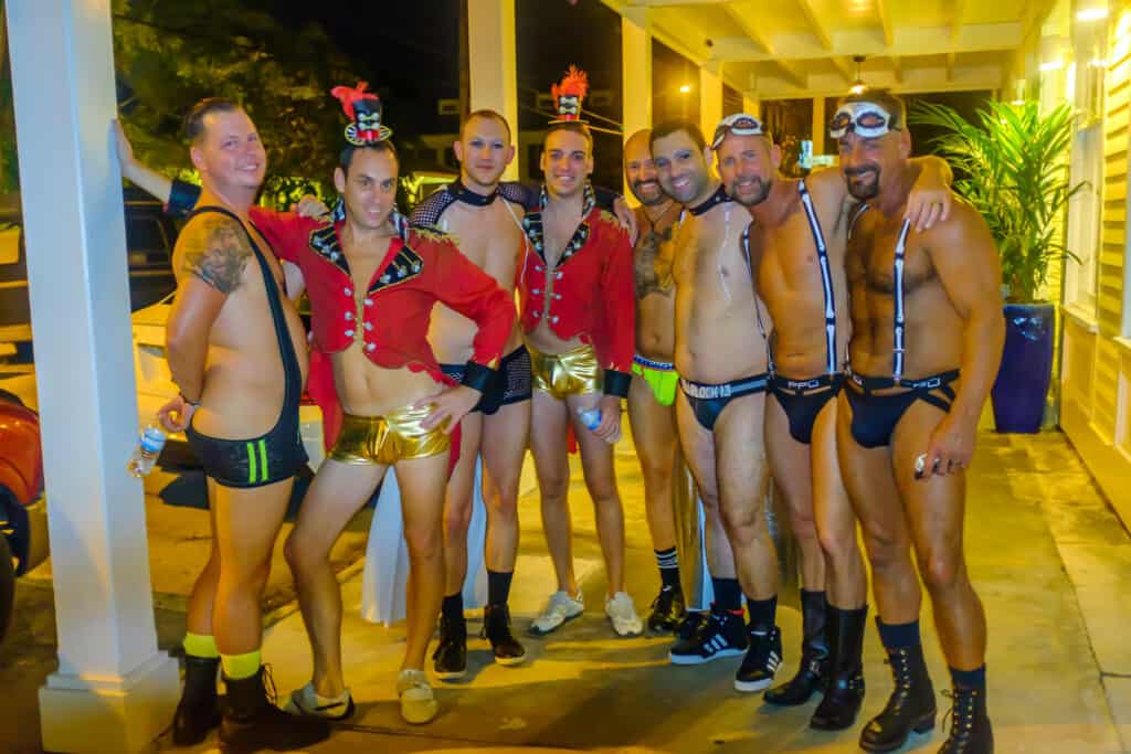 Several men, clad in underwear, getting ready for exposed party at Fantasy Fest.