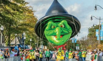 A jolly green witch balloon happily glides along the street, spreading Halloween cheer at Rehoboth Beach Sea Witch Halloween event