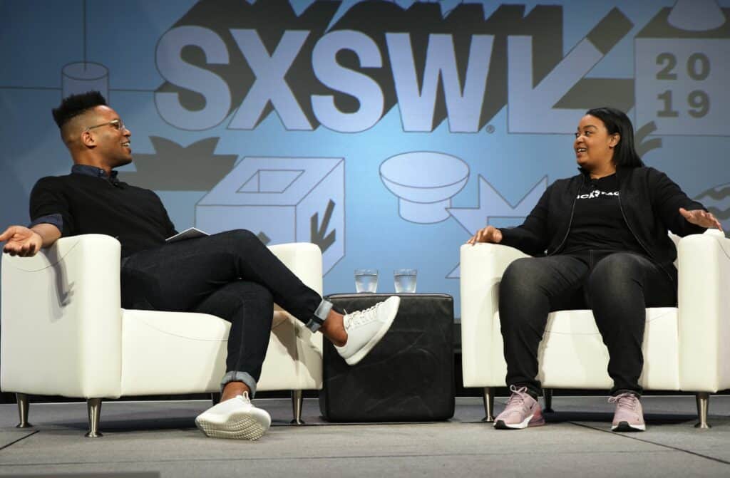 KC Ifeanyi and Arlan Hamilton speaking onstage during their Featured Session at SXSW, discussing the competitive advantage of diversity and investing in startups with humanity.