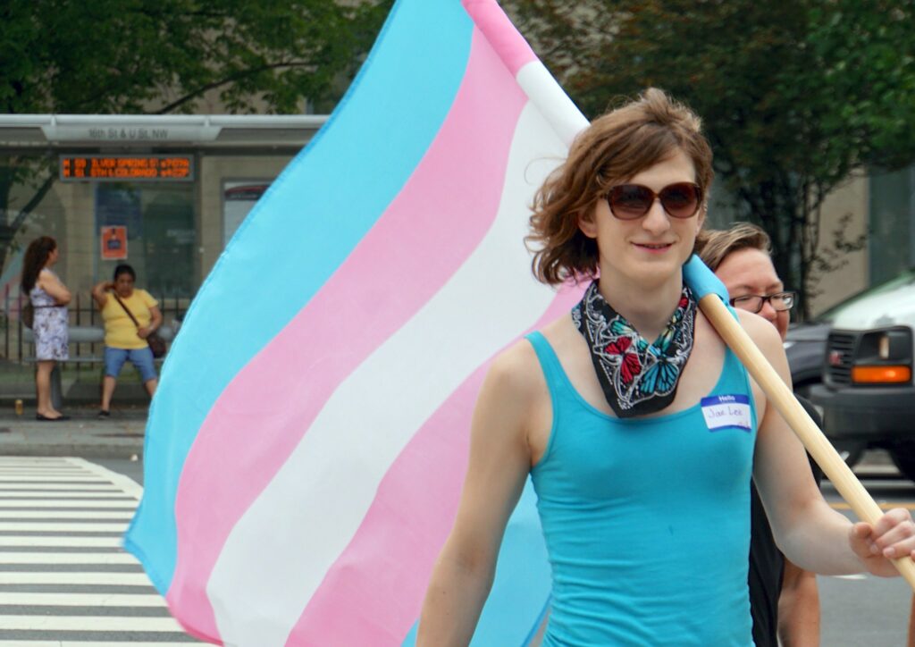 Participant at Capital Trans Pride, highlighting diversity and empowerment in spring LGBTQ+ pride events.