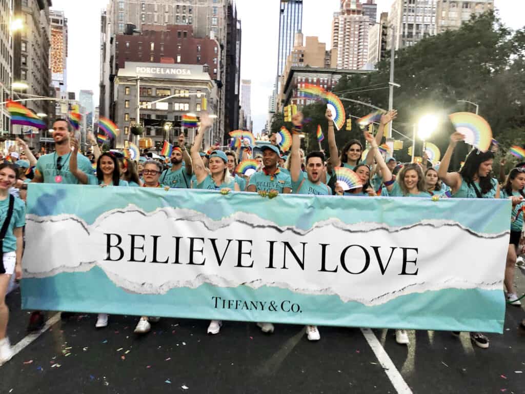 LGBTQ+ workers group from Tiffany & Co. participating in the NYC Pride parade, celebrating diversity and inclusion