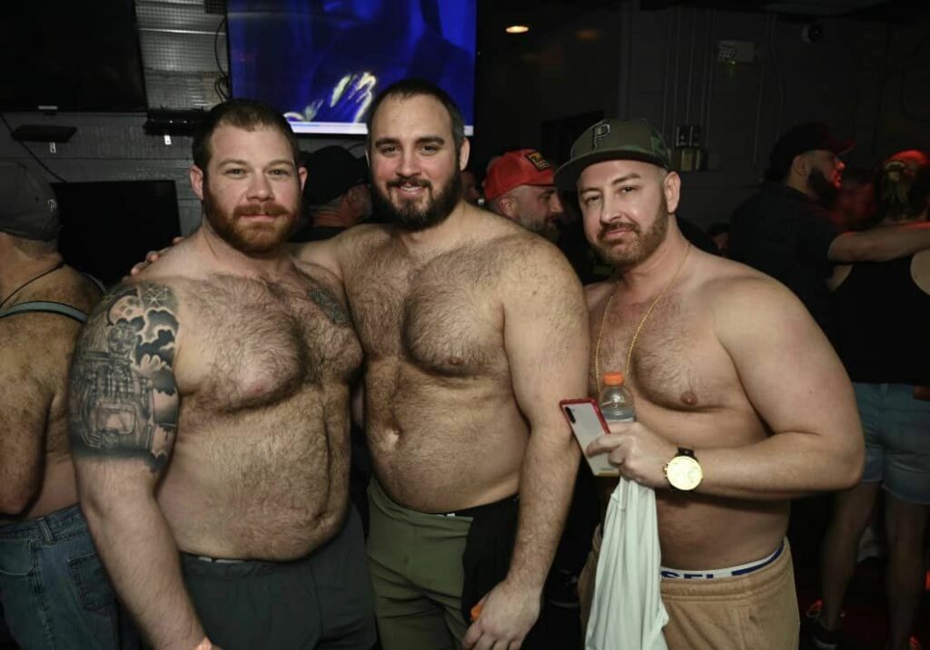 Group of gay 'bear' men at Atlanta Gay Bear Pride, highlighting diversity and inclusion in spring LGBTQ+ pride events.