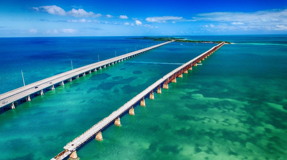 Overseas Highway leading to Key West, Florida, a popular destination for LGBTQ+ spring road trips. Explore scenic views and vibrant culture!