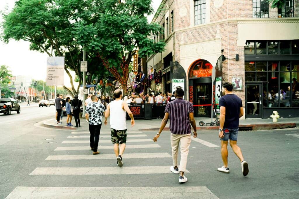 Four gay men crossing Santa Monica Blvd in West Hollywood.