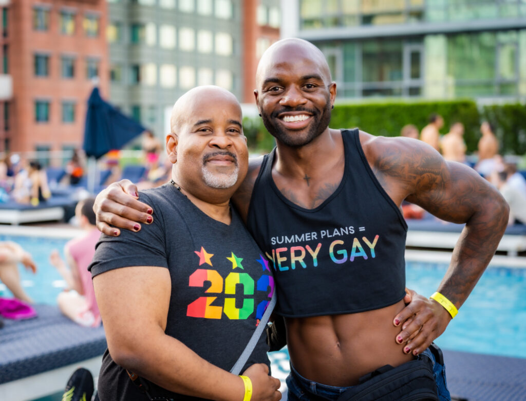 Two African-American gay men celebrating at DC Gay Black Pride, highlighting diversity and empowerment in spring LGBTQ+ pride events.