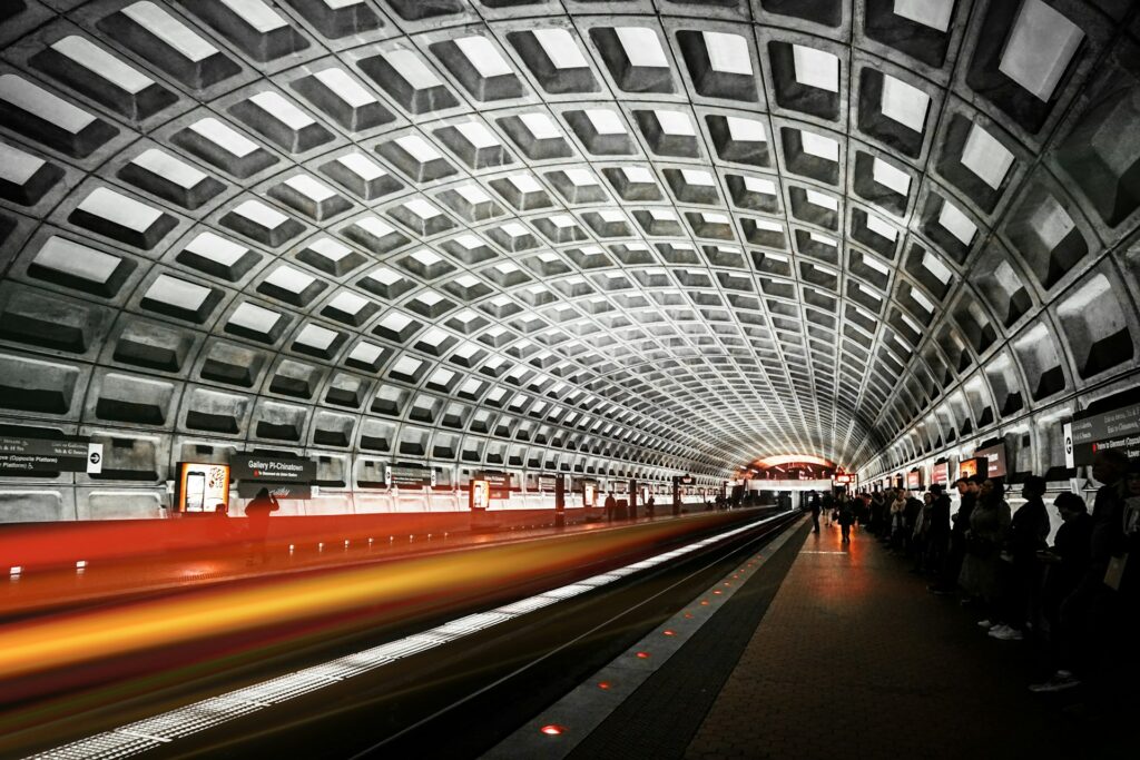 The Washington DC Metro, also known as the Metrorail, serves as a vital transportation network connecting the capital region. Passengers commute on sleek trains through underground tunnels and above-ground tracks, facilitating efficient travel throughout the metropolitan area.