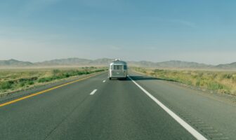 An Airstream on the road, perfect for LGBTQ+ spring road trips. Explore with pride on your next adventure!