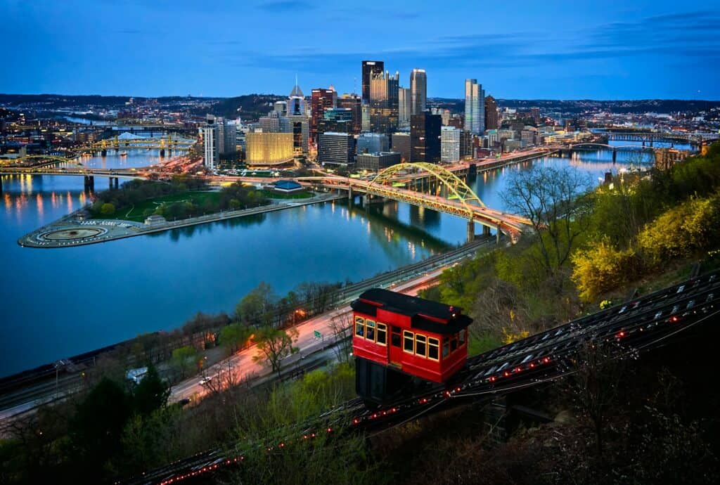 Pittsburgh skyline, featuring the city's iconic bridges and downtown architecture. Explore urban charm on your Keystone state road trip.