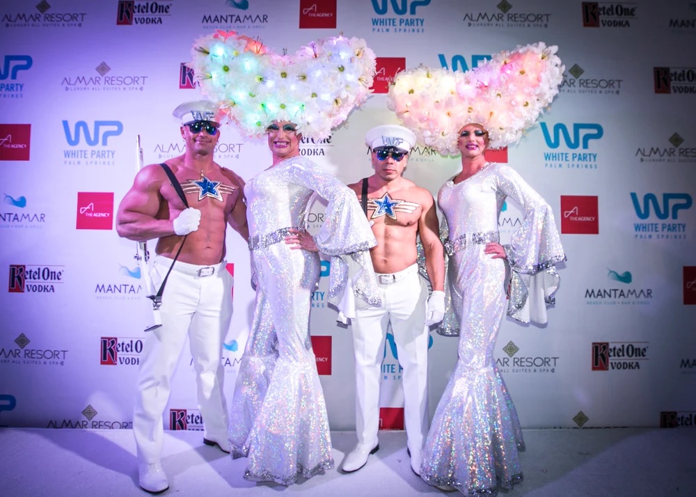 Colorful drag queens in bell bottom pants at White Party Palm Springs 2017, adding flair and diversity to the event.