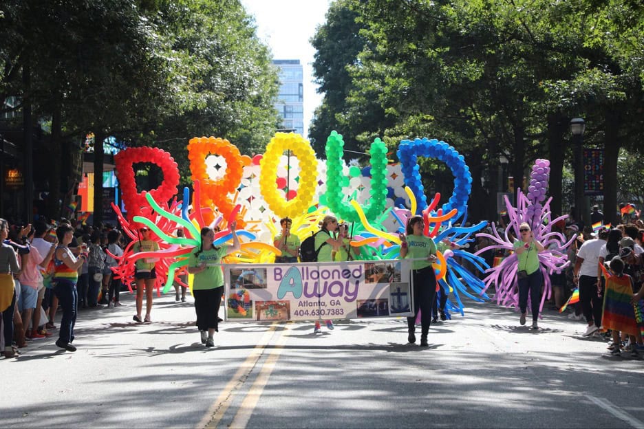 Colorful rainbow balloon display at Atlanta Pride parade, showcasing the energy of fall Pride events 2025 in the South.