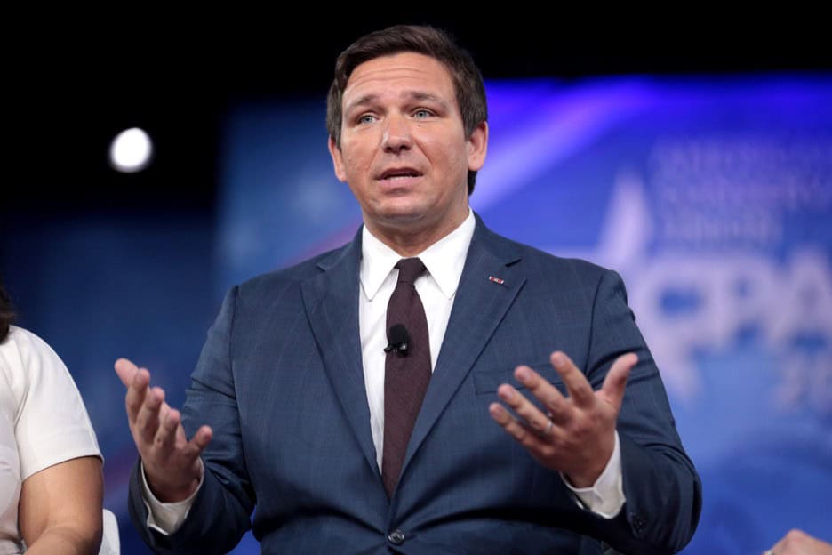 Florida Governor Ron DeSantis speaks at a conservative conference, central to policies tied to tampa pride canceled florida events.