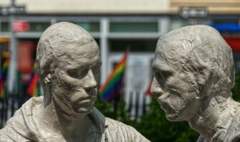 Stonewall National Monument statues with rainbow flags in the background—an iconic site in Hidden LGBTQ+ History USA.