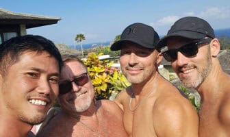 Naked travel for men group selfie at a Bali villa overlooking the ocean