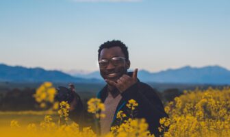 Traveler exploring blooming spring landscapes while visiting one of the best gay spring destinations